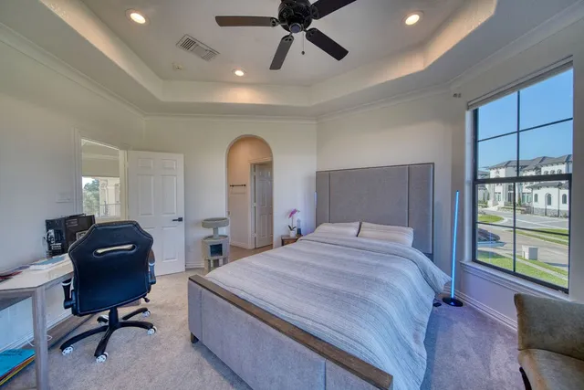 a big house with palm trees in front of it