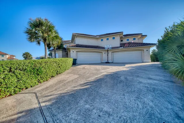 a view of living room kitchen with stainless steel appliances granite countertop lots of counter top space