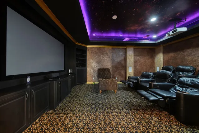 a dining room with furniture and a floor to ceiling window