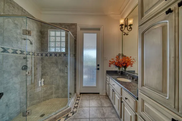 a view of a house with backyard patio and garden