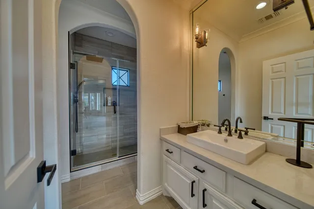 a bathroom with a double vanity sink mirror and double