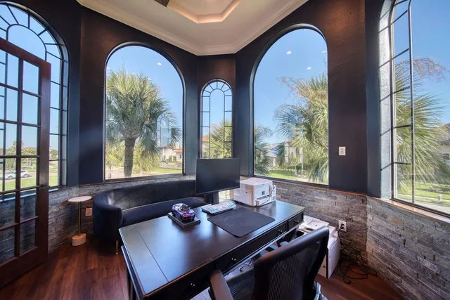 a view of a dining room with furniture and chandelier