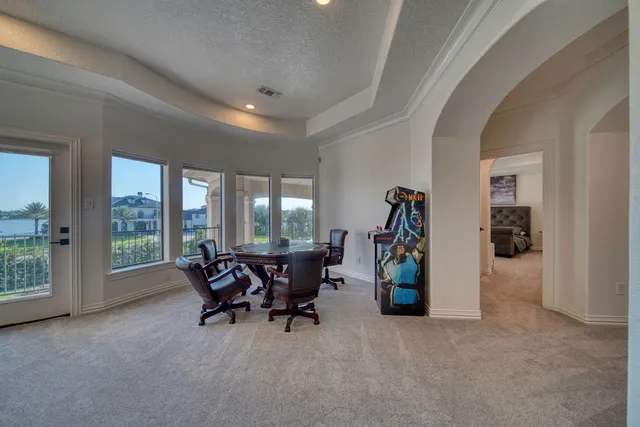 a bathroom with a granite countertop toilet sink and mirror