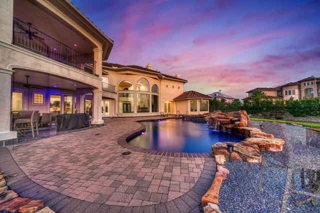 a view of a swimming pool with a patio