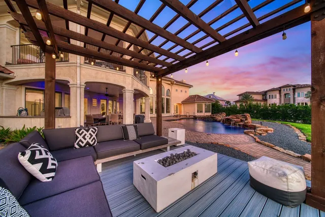 a outdoor living space with patio furniture and a fireplace