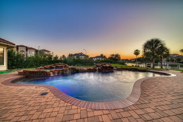 a view of swimming pool with lounge chair