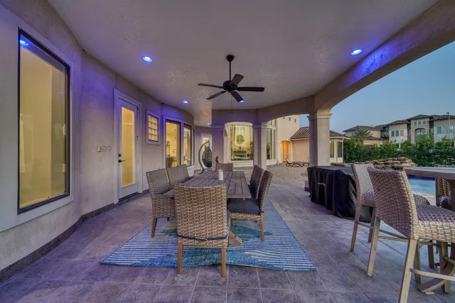 a dining room with wooden floor and a rug