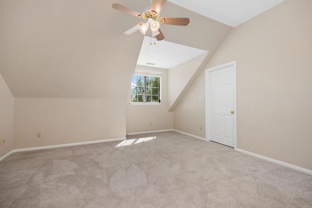 a view of an empty room with a cabinet
