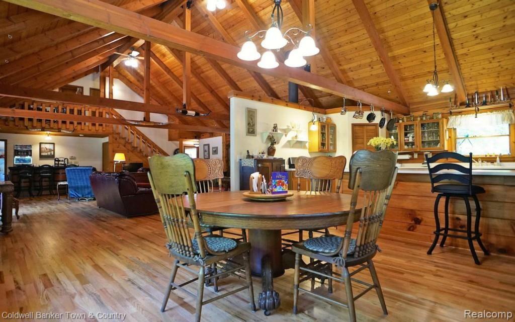 6255 North Owosso Road Fowlerville, MI 48836 - Photo 12 of 31 Dining Kitchen Area with floor to ceiling wood and detailed used of wood accents