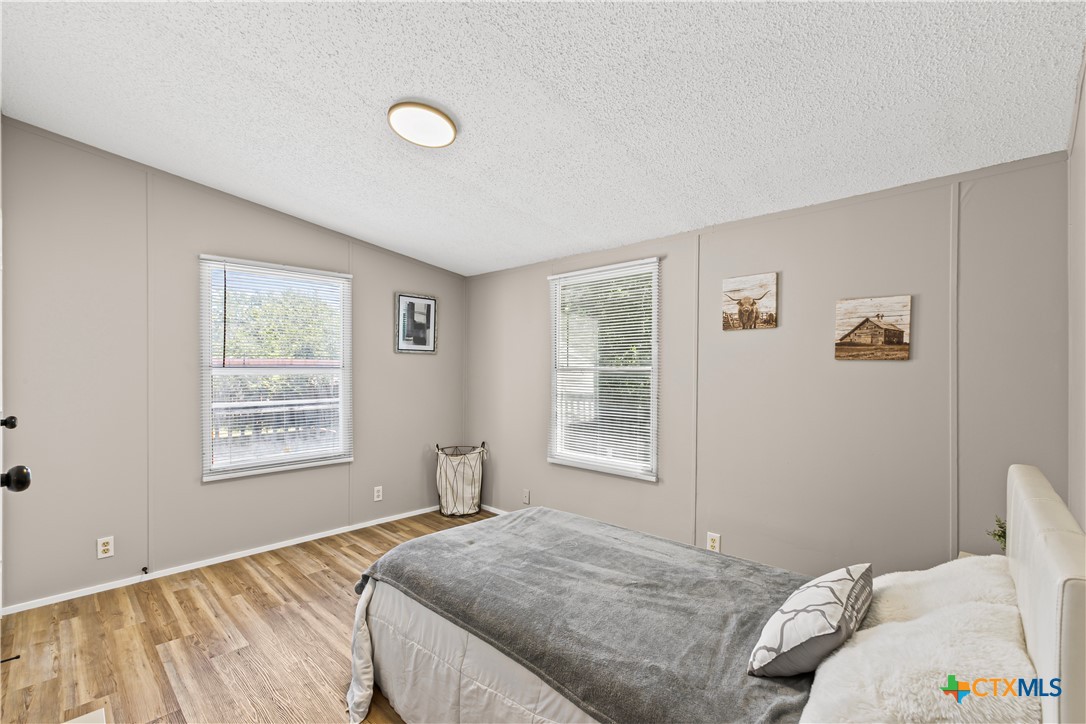 113 Austin Street Gatesville, TX 76528 - Photo 17 of 24 a bedroom with a bed and a window