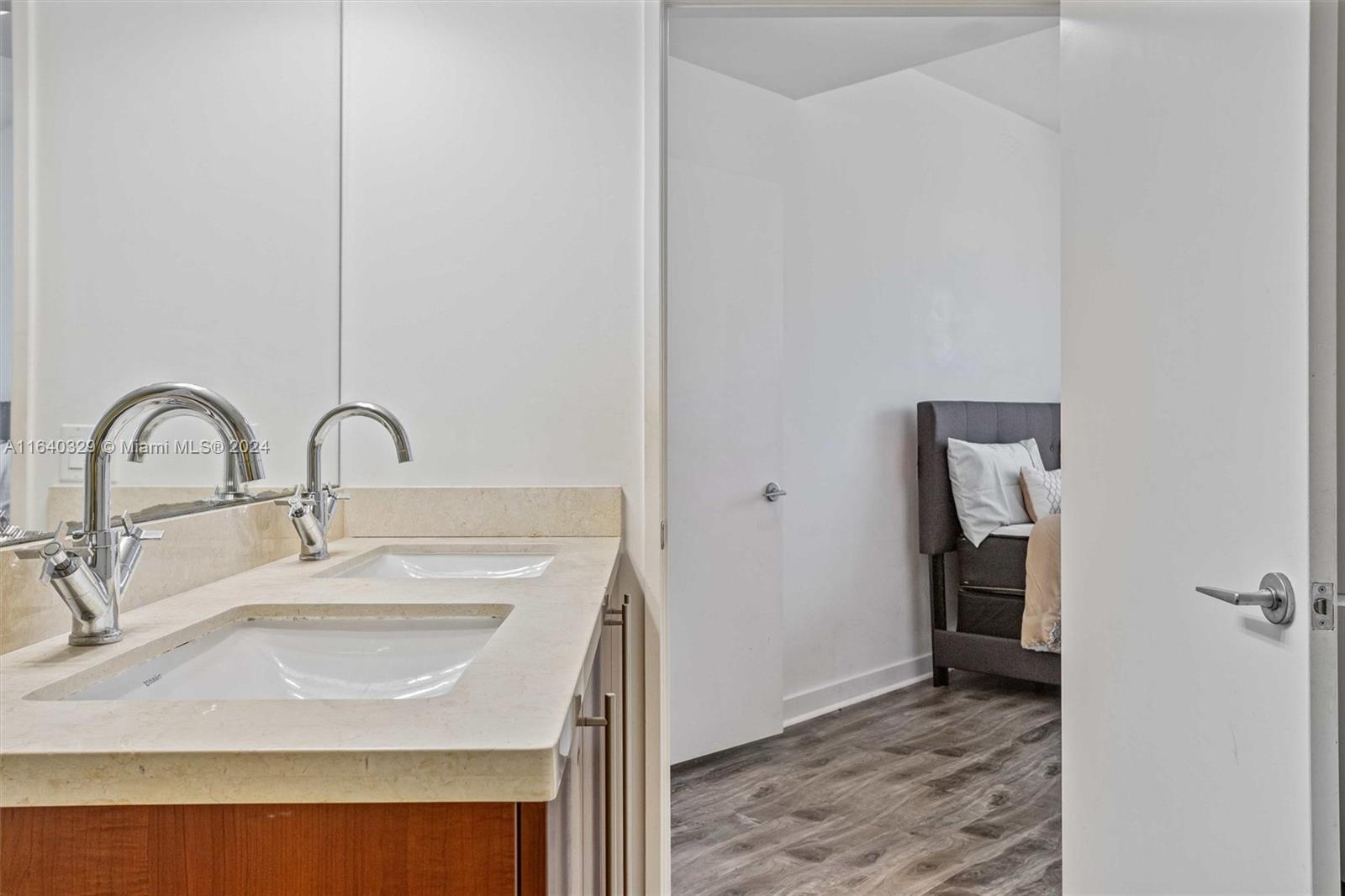 1111 Southwest 1st Avenue, Unit 3014N Miami, FL 33130 - Photo 13 of 36 a bathroom with a sink and a mirror