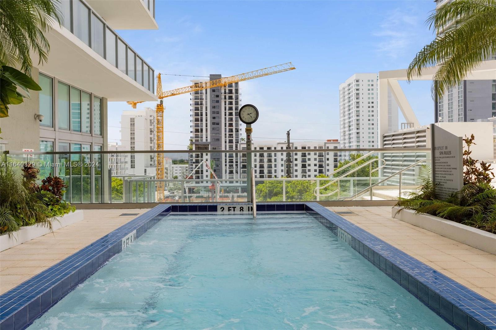 1111 Southwest 1st Avenue, Unit 3014N Miami, FL 33130 - Photo 20 of 36 a view of a terrace with a bench and potted plants