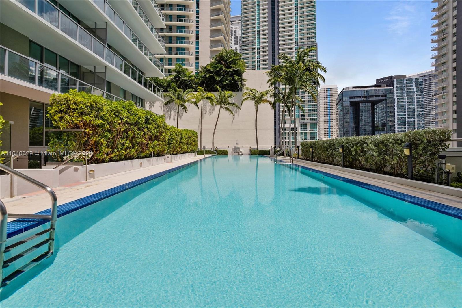 1111 Southwest 1st Avenue, Unit 3014N Miami, FL 33130 - Photo 23 of 36 a view of a house with a swimming pool and sitting area