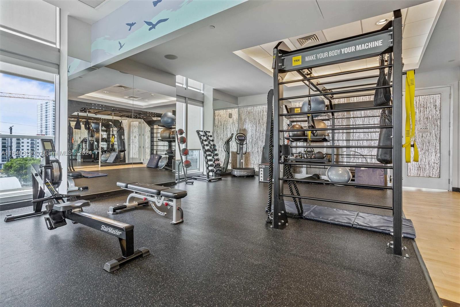 1111 Southwest 1st Avenue, Unit 3014N Miami, FL 33130 - Photo 24 of 36 a view of a room with gym equipment