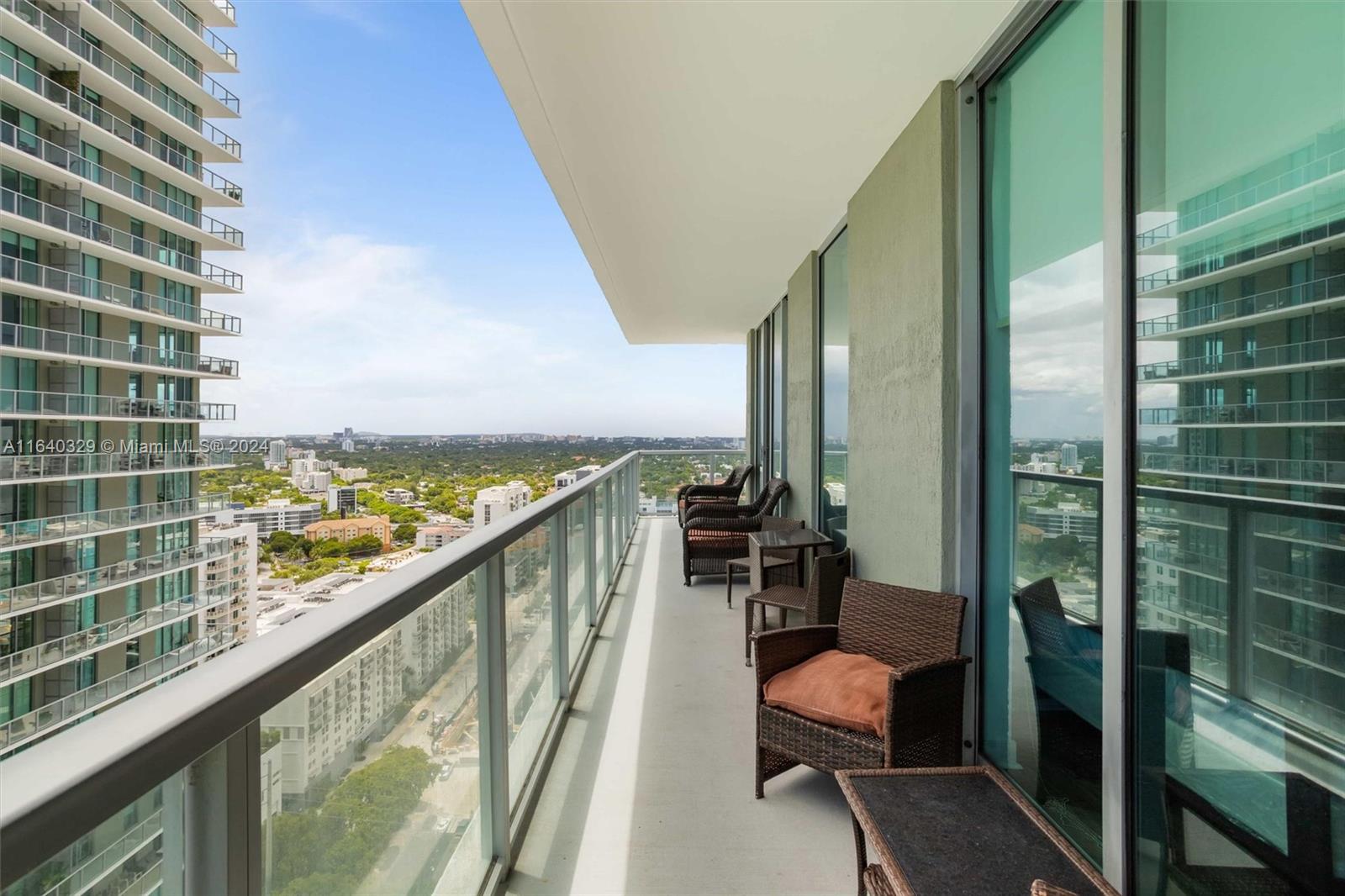 1111 Southwest 1st Avenue, Unit 3014N Miami, FL 33130 - Photo 5 of 36 a view of a balcony with chair and the balcony