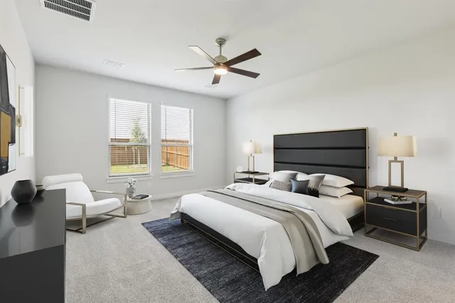 an empty room with closet and ceiling fan