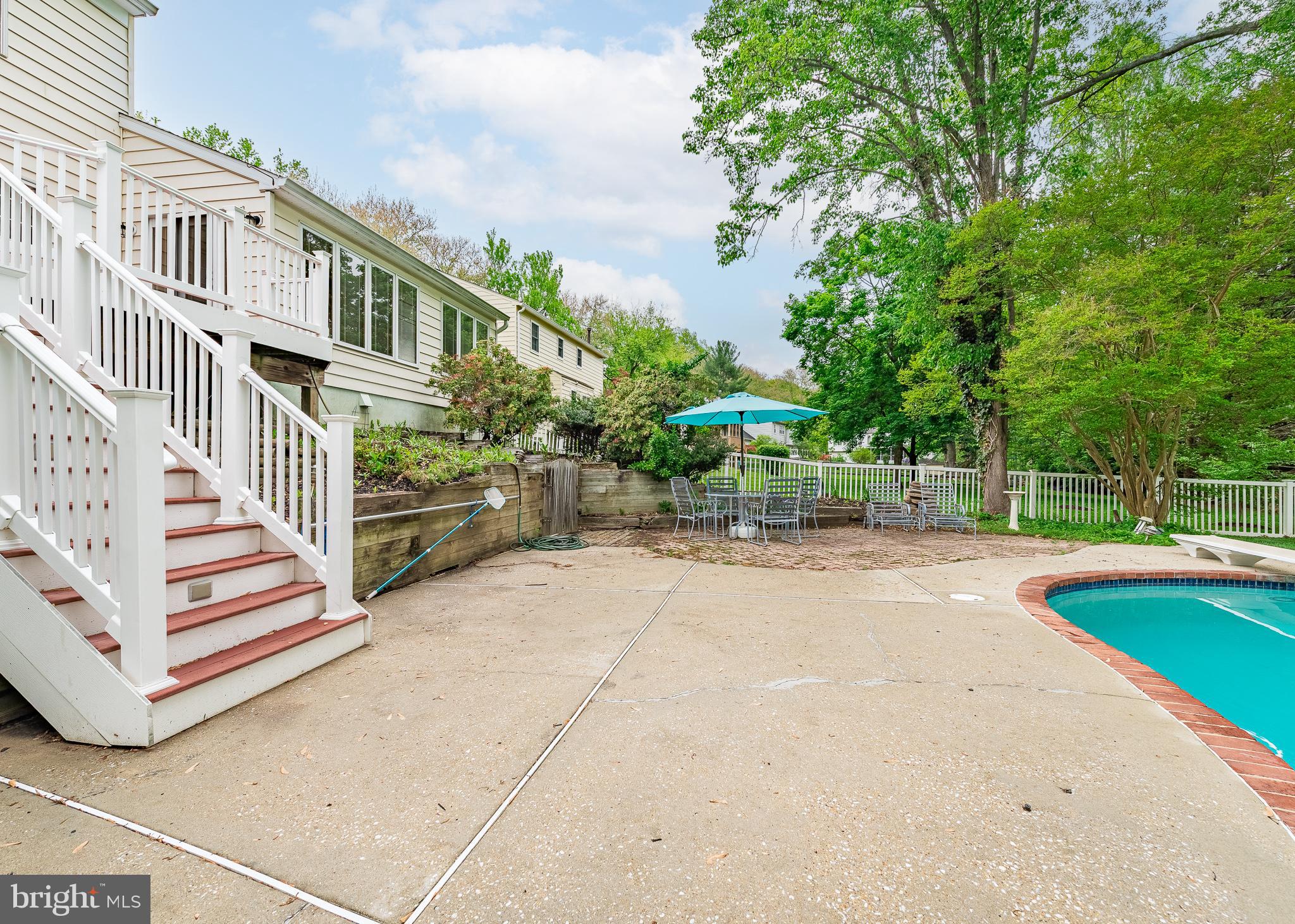 4945 West Running Brook Road Columbia, MD 21044 - Photo 51 of 65 Concrete surrounded pool area