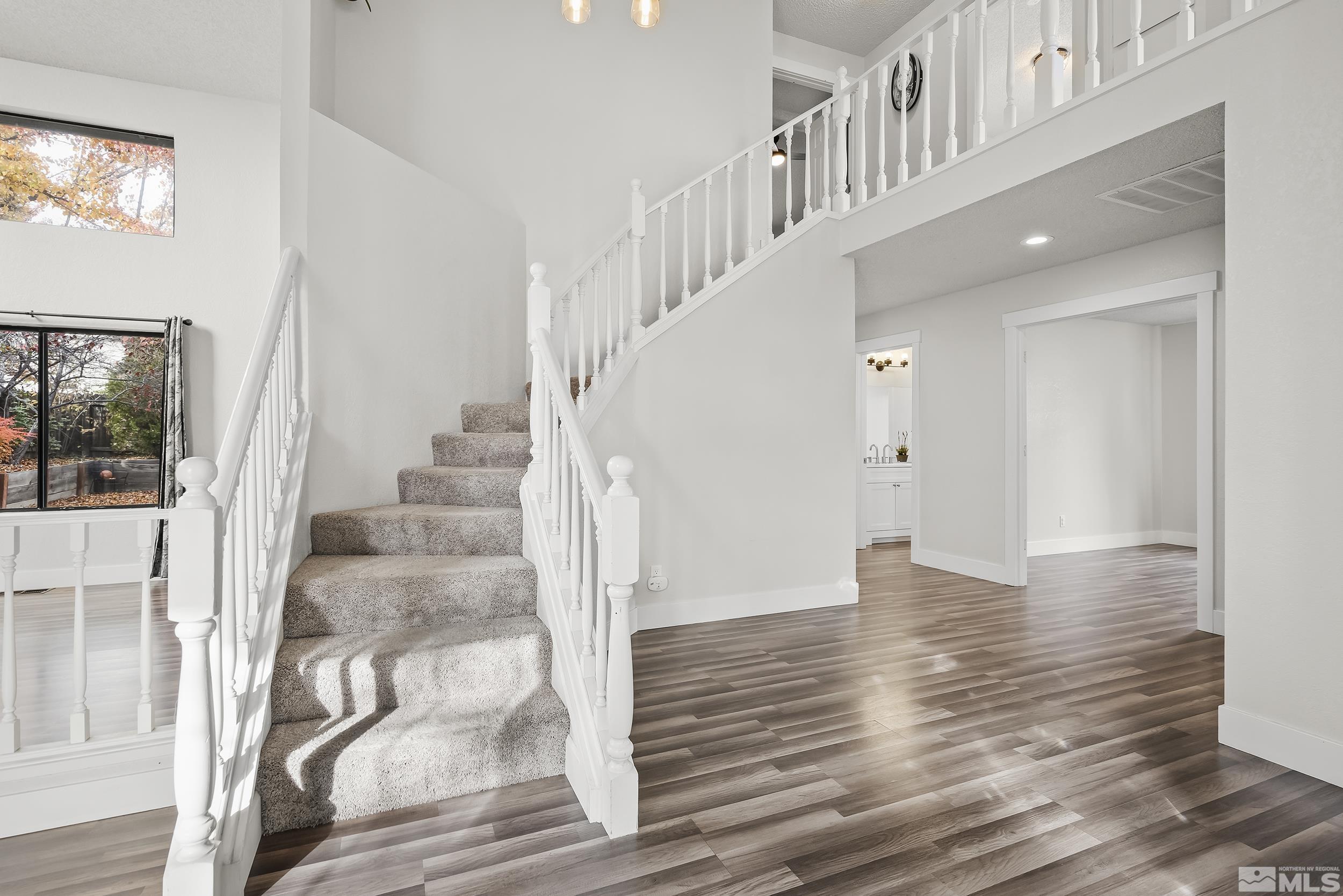 5651 West Rainbow Ridge Court Reno, NV 89523 - Photo 3 of 26 a view of entryway and hall with wooden floor