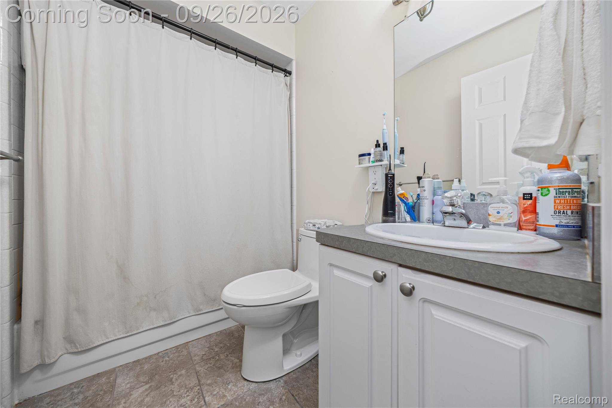7021 Fox Path Canton, MI 48187 - Photo 39 of 59 White vanity with an integrated sink and chrome faucet, set against light-colored walls