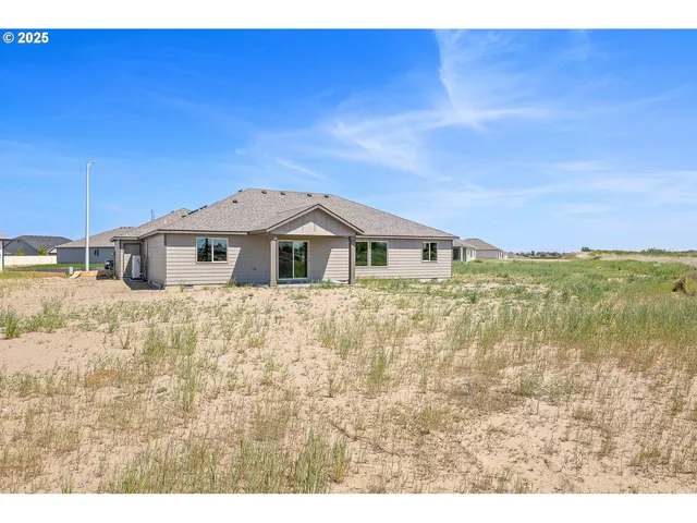 a house view with a garden space