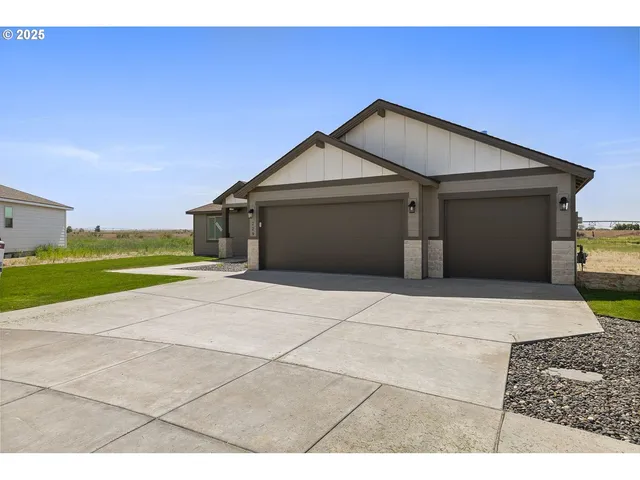 a view of garage and yard
