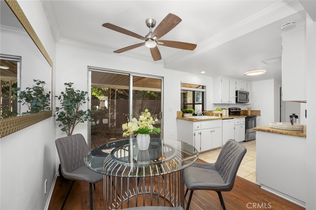 914 Fairview Avenue, Unit 13 Arcadia, CA 91007 - Photo 12 of 39 a dining room with furniture a potted plant and a kitchen view