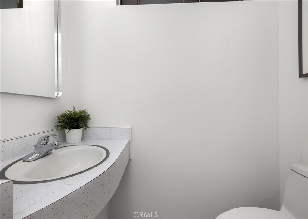 914 Fairview Avenue, Unit 13 Arcadia, CA 91007 - Photo 18 of 39 a bathroom with a sink a toilet and mirror