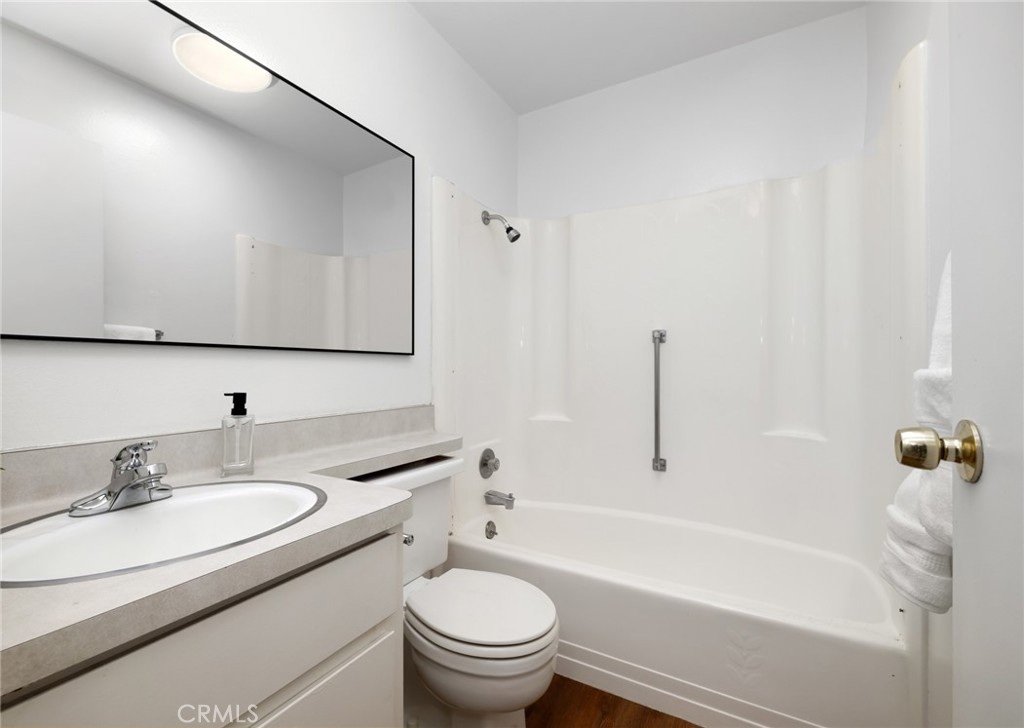 914 Fairview Avenue, Unit 13 Arcadia, CA 91007 - Photo 28 of 39 a bathroom with a granite countertop sink a toilet and bathtub