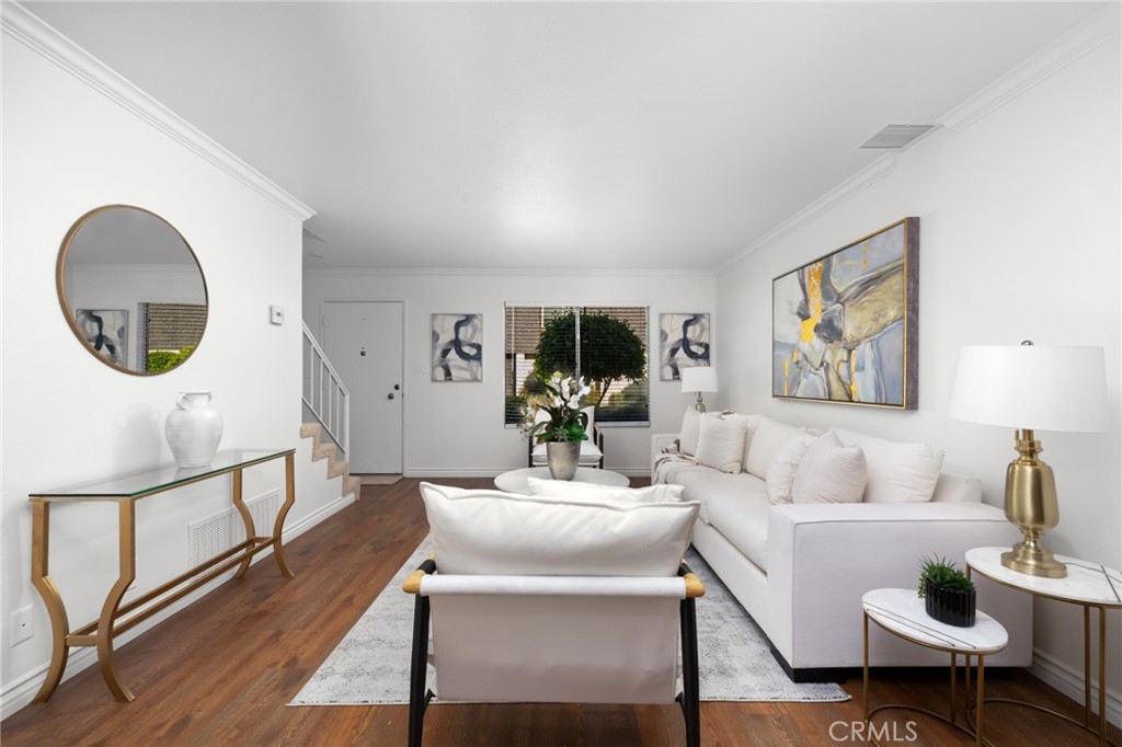 914 Fairview Avenue, Unit 13 Arcadia, CA 91007 - Photo 8 of 39 a living room with furniture a rug and a mirror