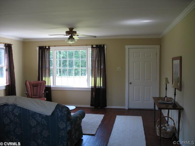 17072 Ancient Acres Road Beaverdam, VA 23015 - Photo 3 of 7 a bedroom with a bed and wooden floor