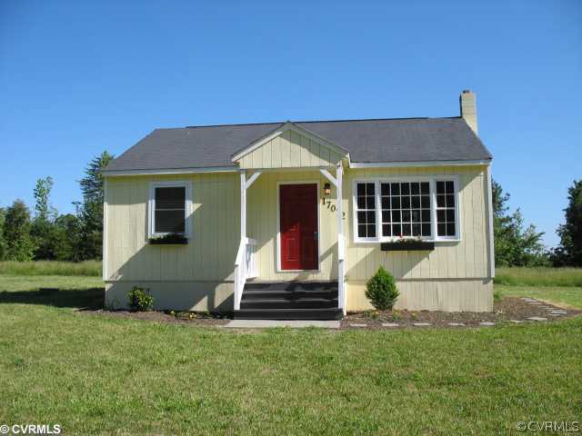 17072 Ancient Acres Road Beaverdam, VA 23015 - Photo 5 of 7 a front view of a house with garden