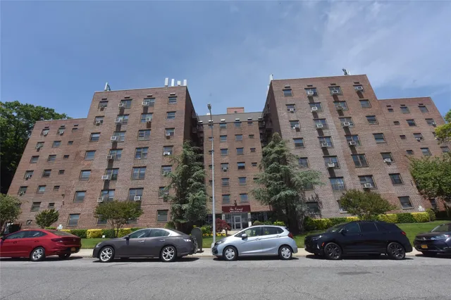 a room with gym equipment and wooden floor