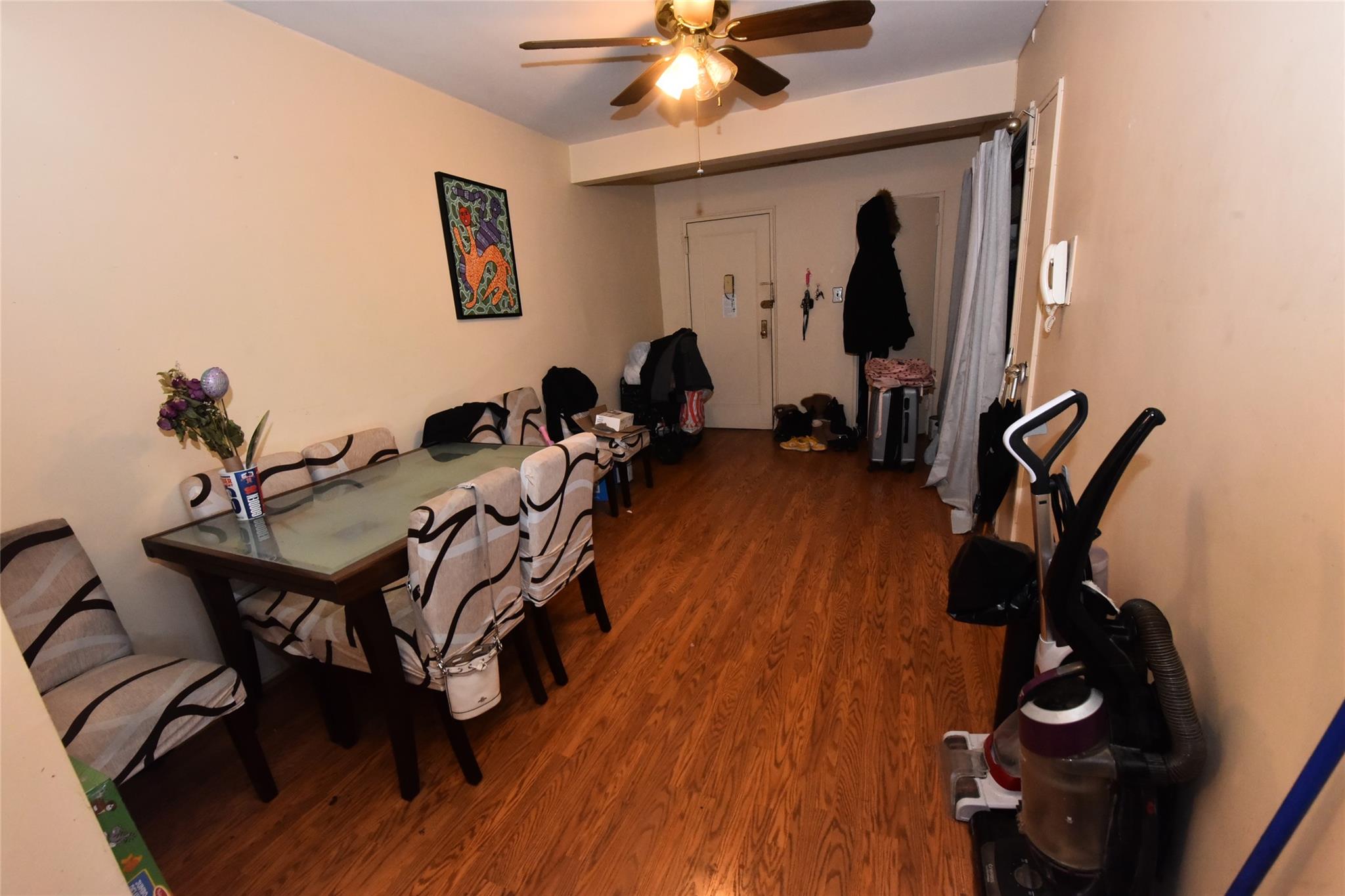 202-35 Foothill Avenue, Unit A78 Queens, NY 11423 - Photo 3 of 12 a room with gym equipment and wooden floor