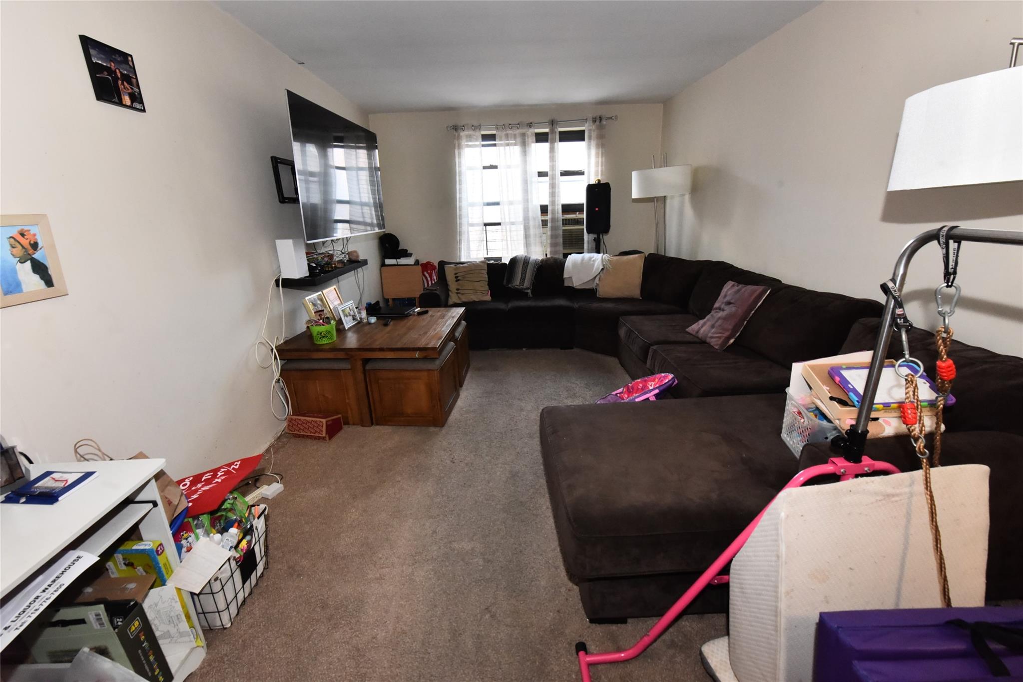 202-35 Foothill Avenue, Unit A78 Queens, NY 11423 - Photo 4 of 12 a living room with furniture and a wooden floor