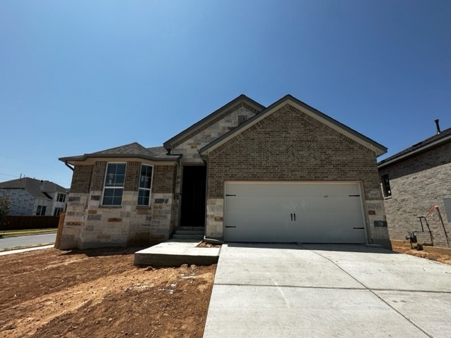 a front view of a house with garage