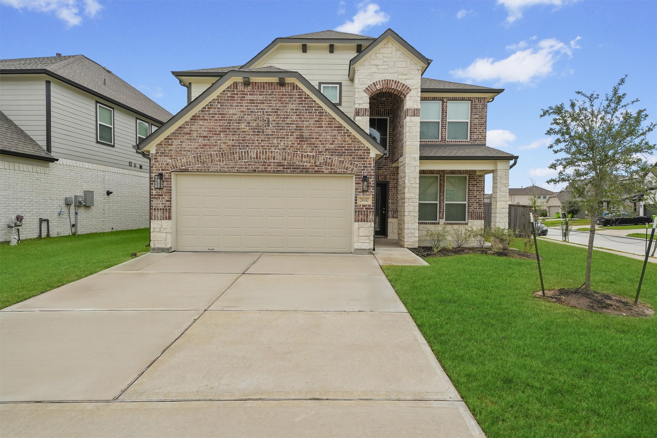 29357 Sycamore Cave Lane Spring, TX 77386 - Photo 1 of 21 a front view of a house with a yard and garage