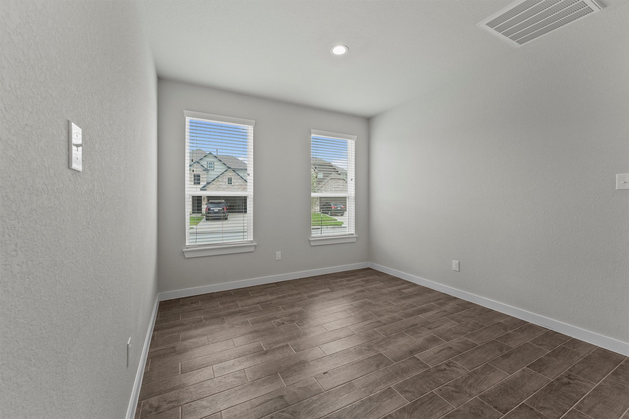 29357 Sycamore Cave Lane Spring, TX 77386 - Photo 3 of 21 an empty room with wooden floor and windows