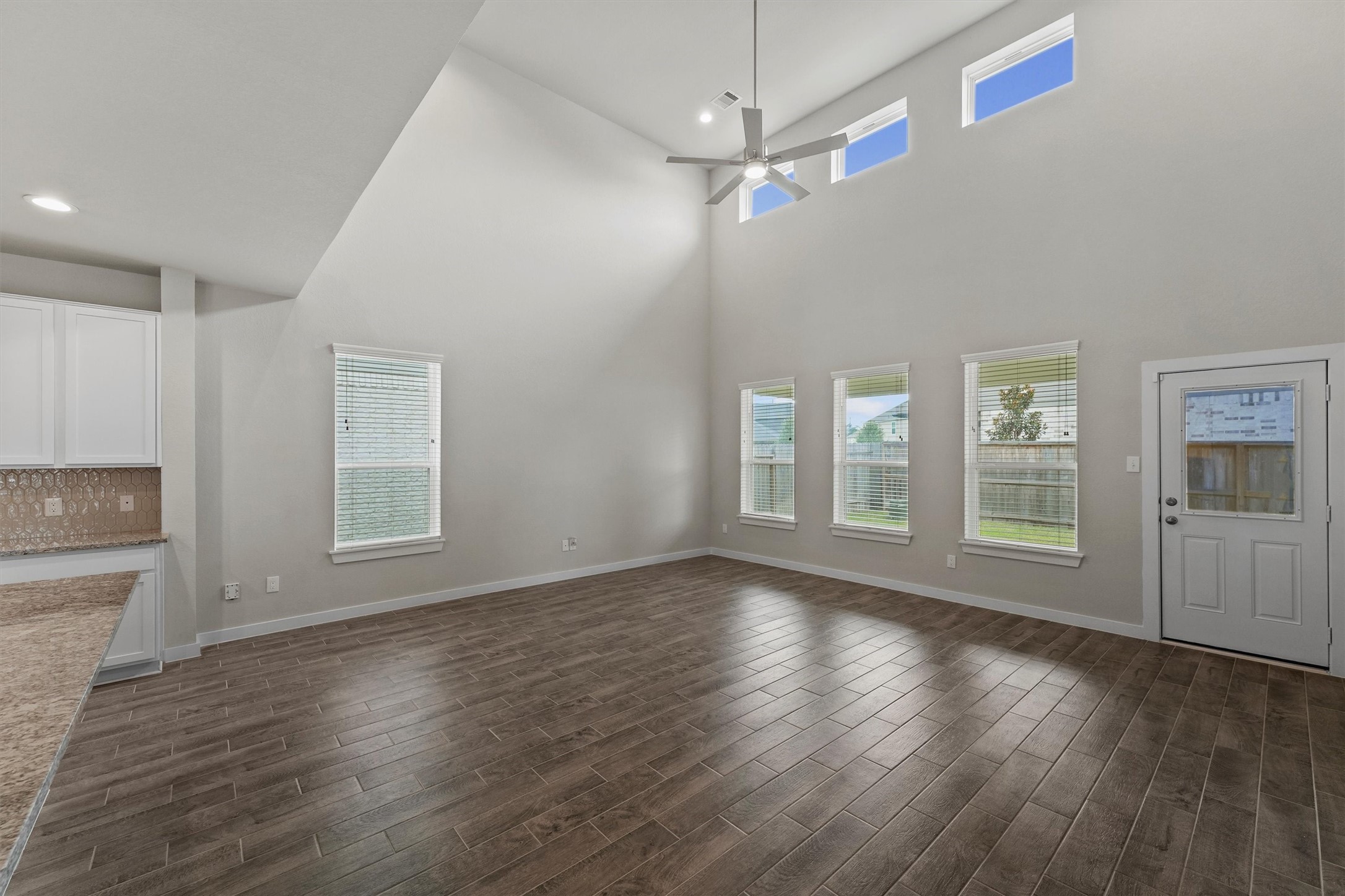 29357 Sycamore Cave Lane Spring, TX 77386 - Photo 4 of 21 a view of an empty room with wooden floor and a window