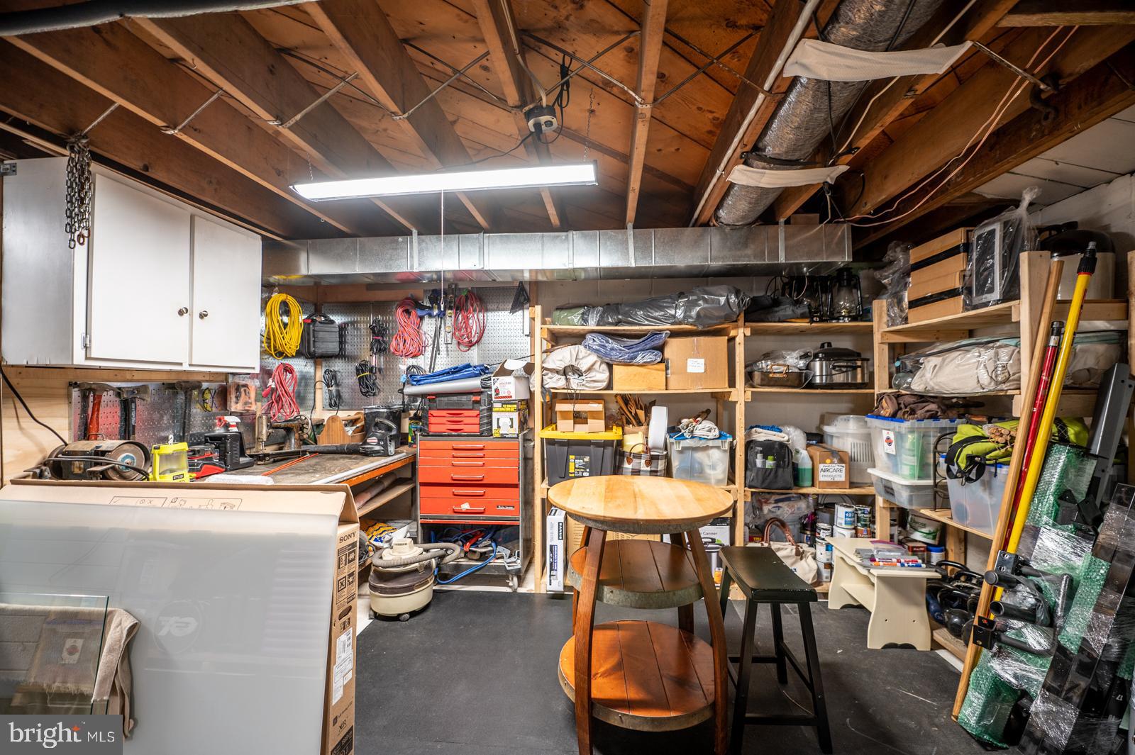 111 Midway Road Phoenixville, PA 19460 - Photo 56 of 77 Work room with work bench and shelves and flooring
