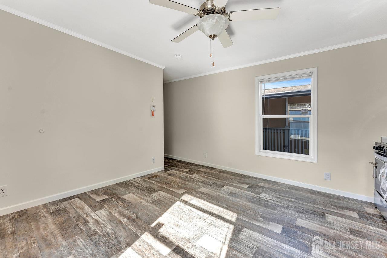 2505 Woodbridge Avenue, Unit 19L Edison, NJ 08817 - Photo 4 of 8 a view of an empty room with a window