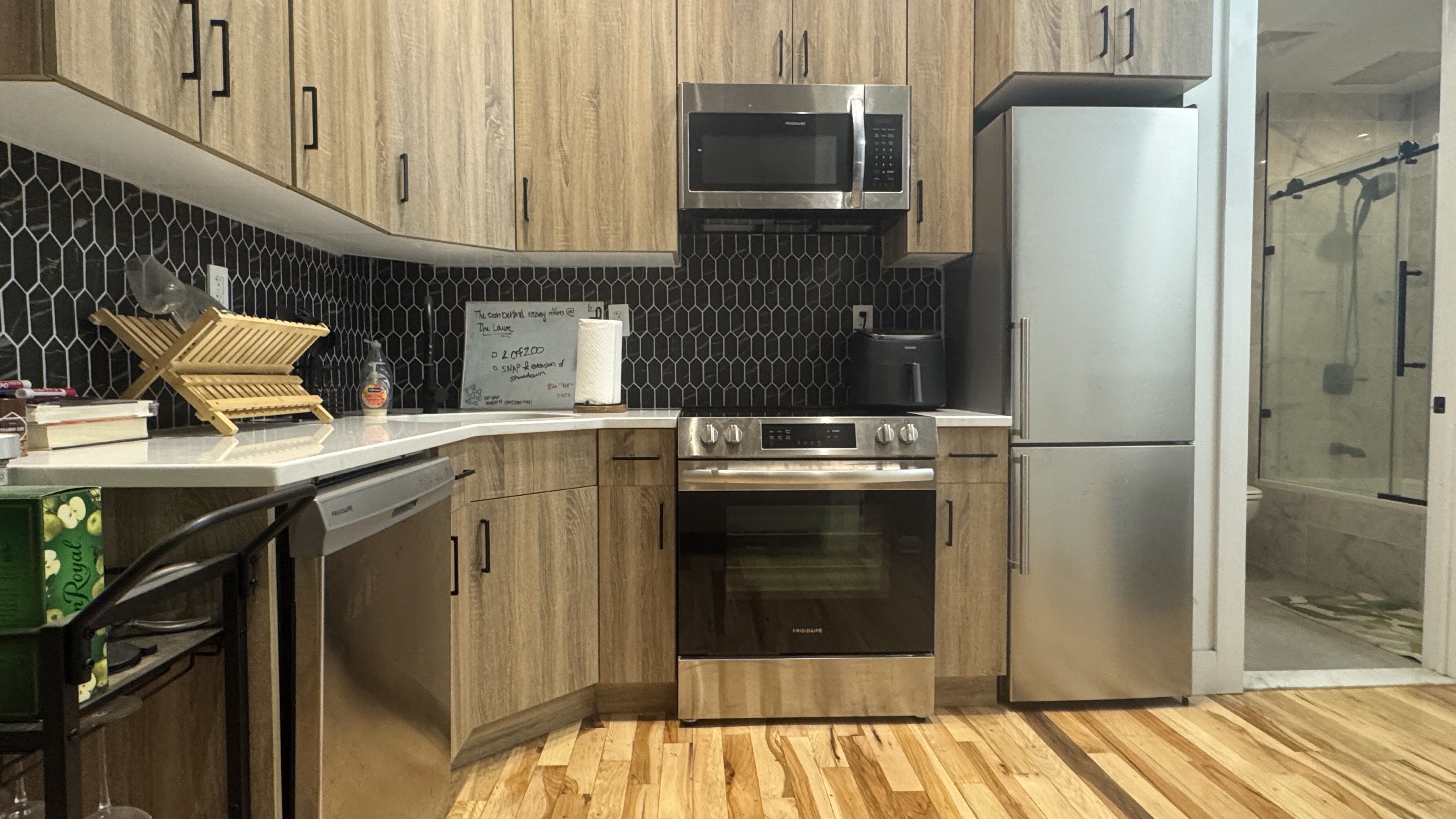 595 3rd Avenue, Unit 1B Brooklyn, NY 11215 - Photo 2 of 8 a kitchen with stainless steel appliances a refrigerator stove and cabinets