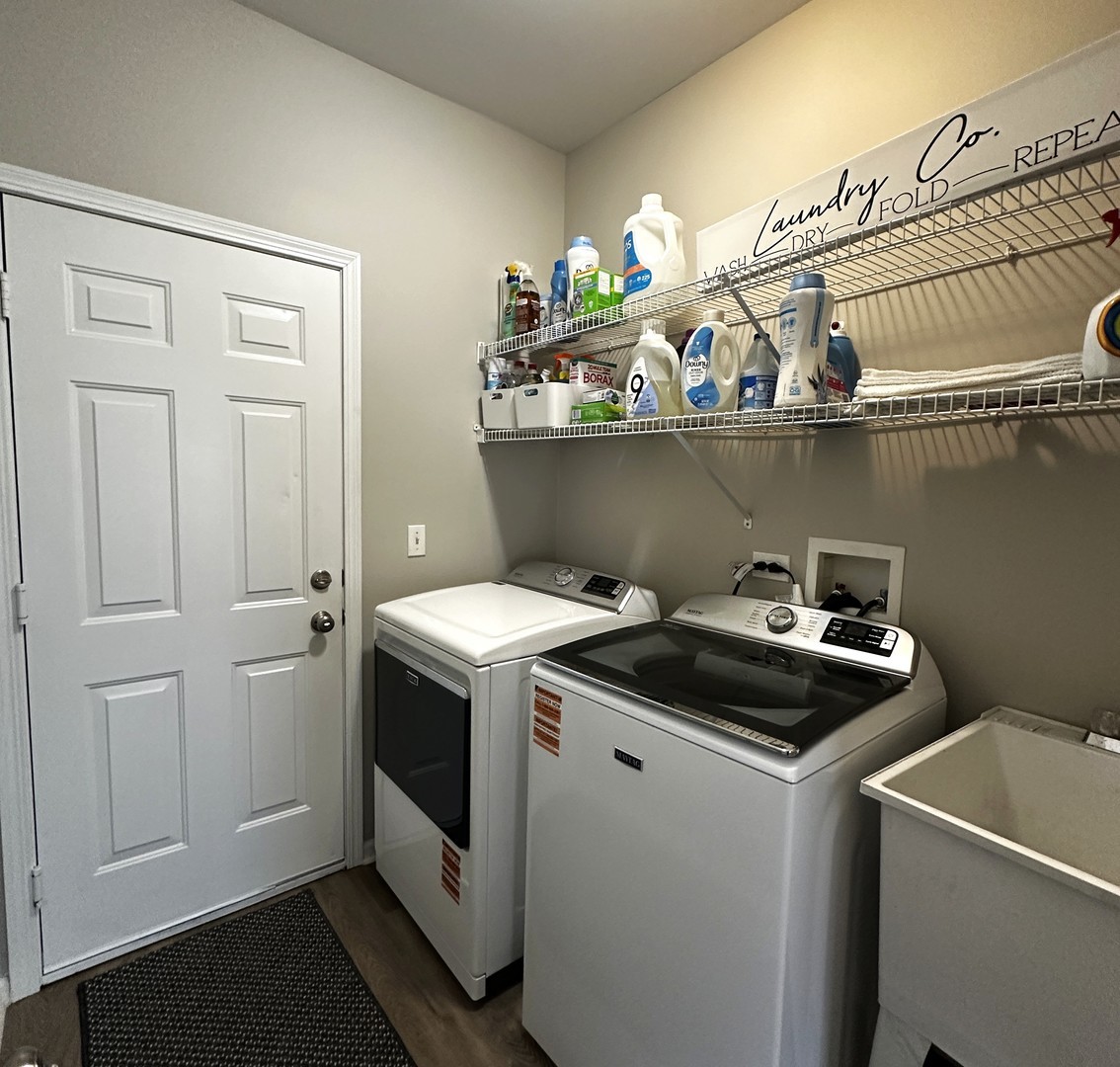 1688 Trails End Lane Bolingbrook, IL 60490 - Photo 16 of 18 a utility room with dryer and washer