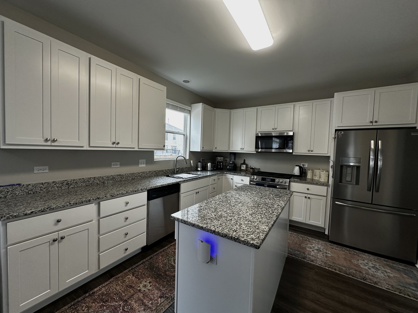 1688 Trails End Lane Bolingbrook, IL 60490 - Photo 2 of 18 a kitchen with stainless steel appliances granite countertop a sink stove and refrigerator