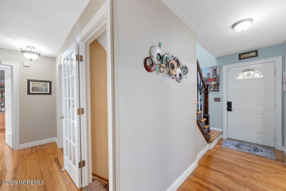39 Cypress Road Toms River, NJ 08753 - Photo 11 of 52 a view of a hallway with wooden floor and closet