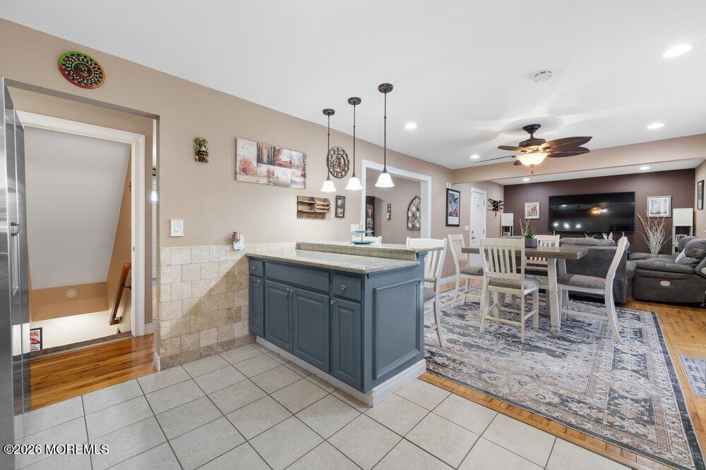 39 Cypress Road Toms River, NJ 08753 - Photo 14 of 52 a kitchen with stainless steel appliances kitchen island granite countertop a sink and cabinets