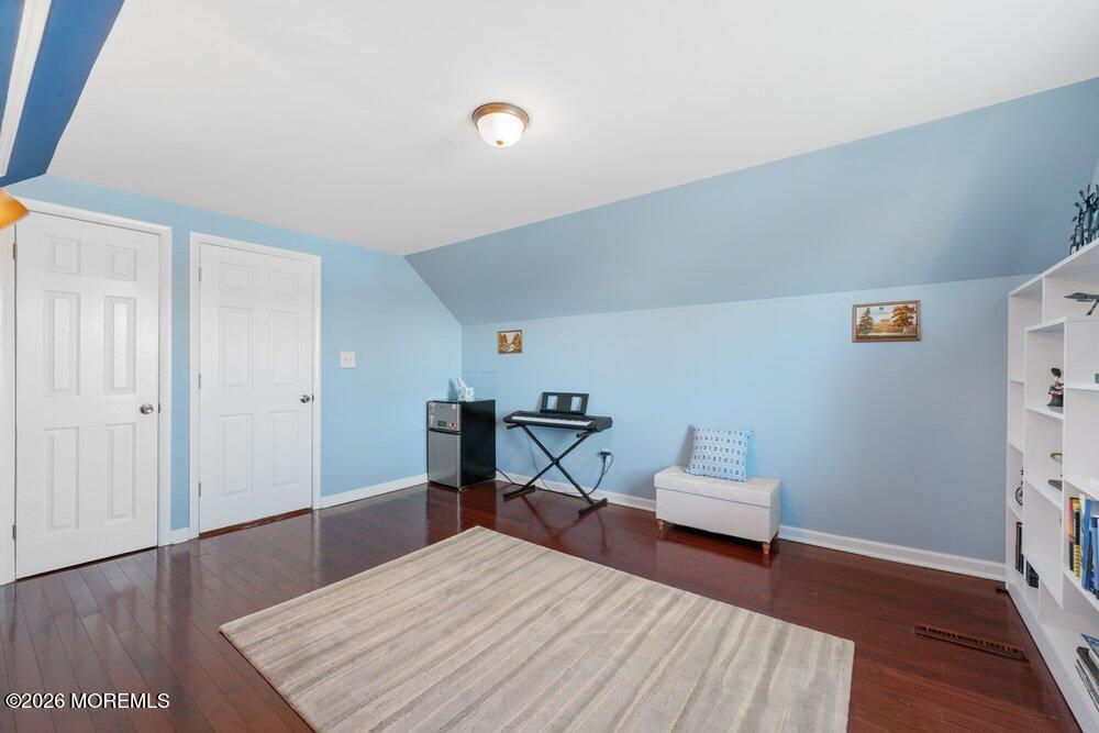 39 Cypress Road Toms River, NJ 08753 - Photo 29 of 52 a bedroom with a bed and wooden floor