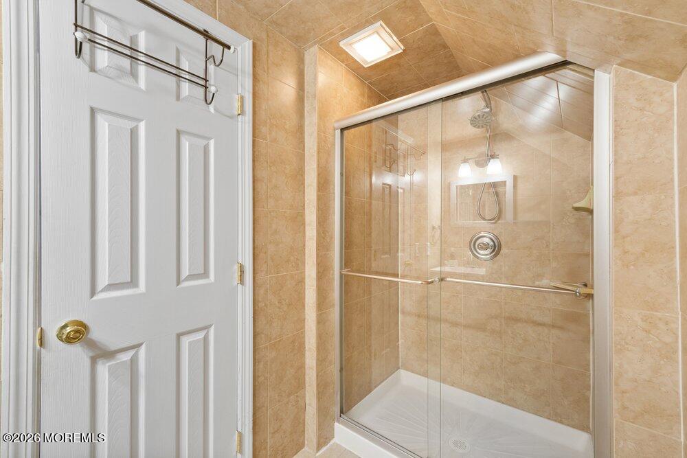 39 Cypress Road Toms River, NJ 08753 - Photo 31 of 52 a bathroom with a glass shower door