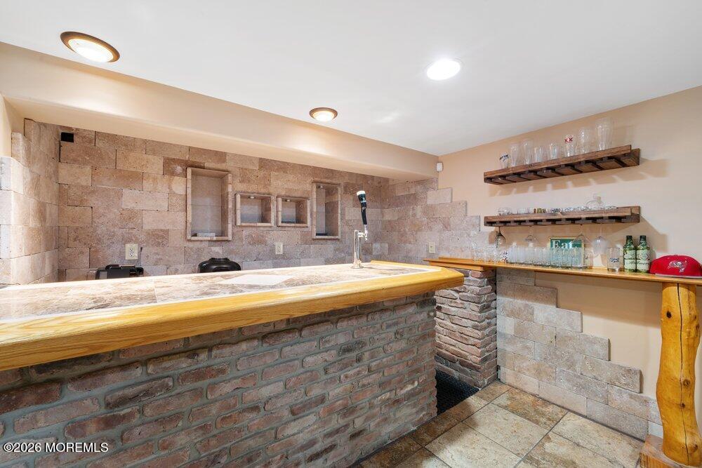 39 Cypress Road Toms River, NJ 08753 - Photo 34 of 52 a view of a kitchen with kitchen island a sink stainless steel appliances and cabinets