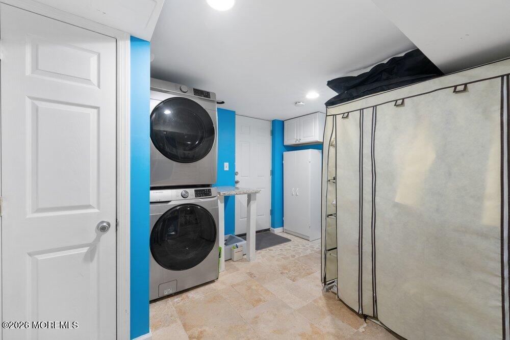 39 Cypress Road Toms River, NJ 08753 - Photo 40 of 52 a view of a hallway with washer and dryer
