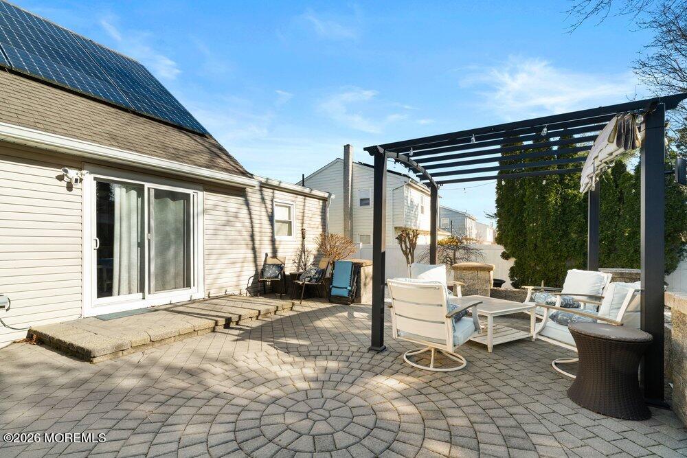 39 Cypress Road Toms River, NJ 08753 - Photo 41 of 52 a building outdoor space with patio furniture and garden view